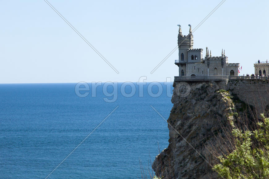 The castle by the sea is on the rock highly above water