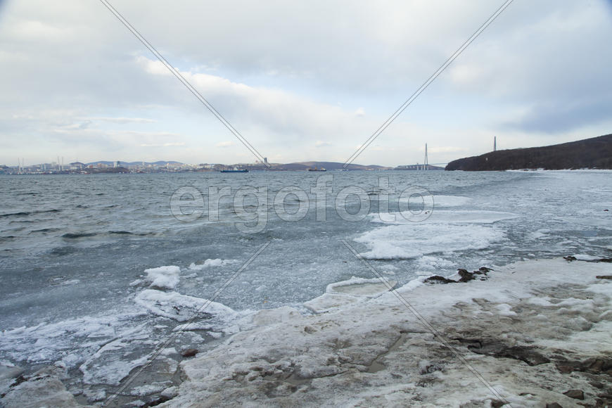 Ice at the sea in the early spring yet not all has descended