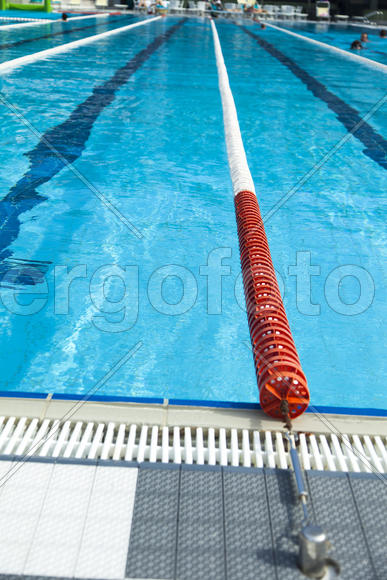 The swimming pool under beams of the sun is ready to competitions and rest