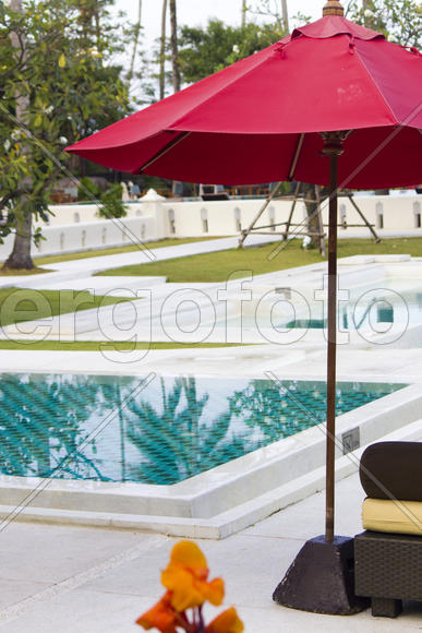 Umbrellas at the pool wait for visitors early in the morning