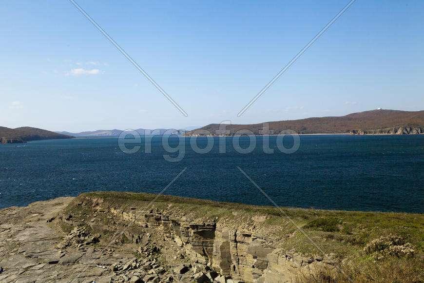 The sea under the bright autumn sun prepares for winter