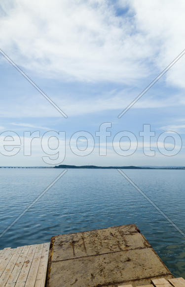Sea landscape in cloudy day at a full calm
