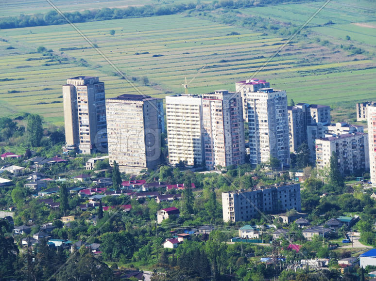 The city by the sea bathes in bright beams of the sun