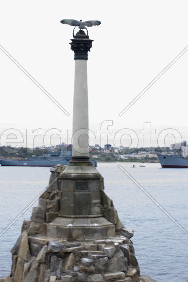 Monument to the flooded Russian ships in a bay