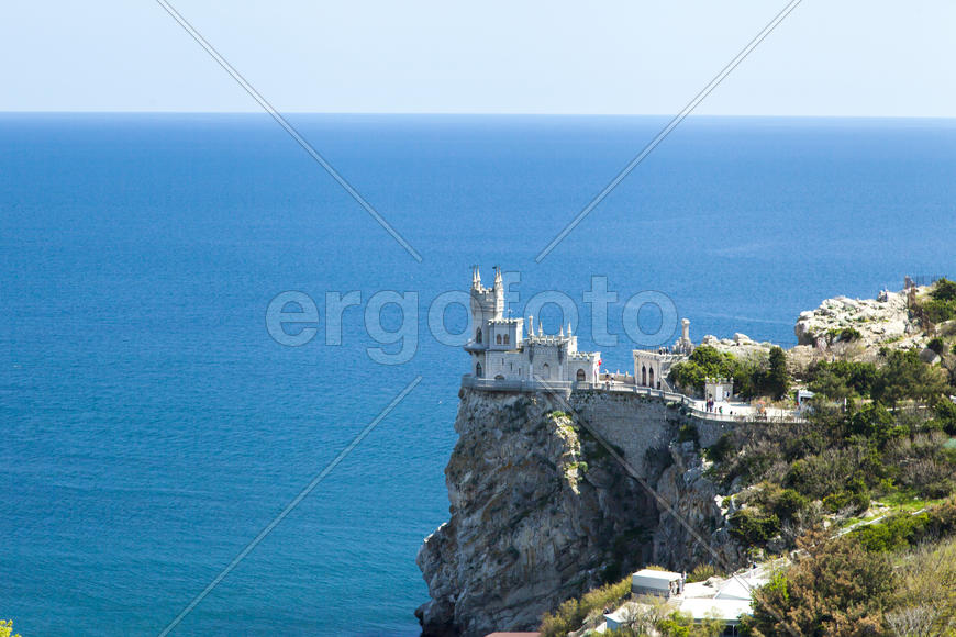 The castle by the sea is on the rock highly above water