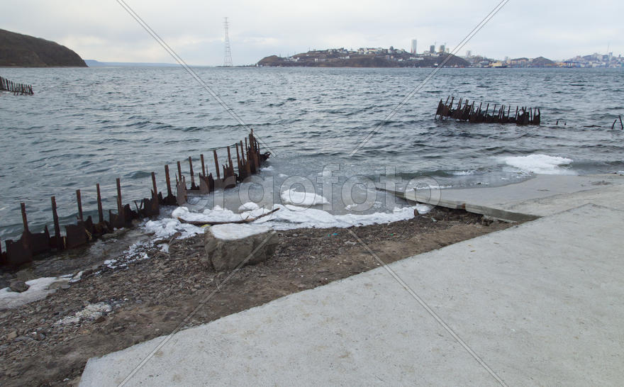 Ice at the sea in the early spring yet not all has descended