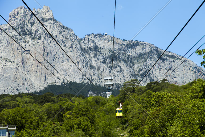 Ropeway on the high mountain in the sunny day