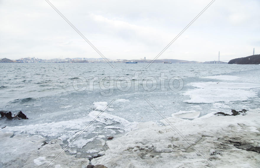 Ice at the sea in the early spring yet not all has descended