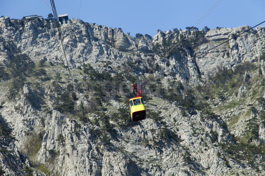 Ropeway on the high mountain in the sunny day