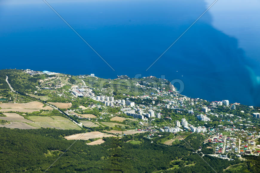 The seashore in the light of the sun from big height
