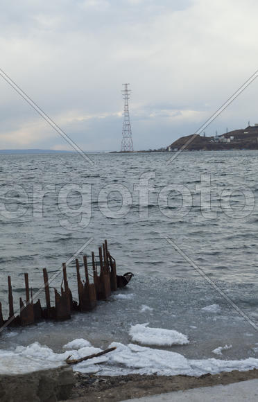 Ice at the sea in the early spring yet not all has descended
