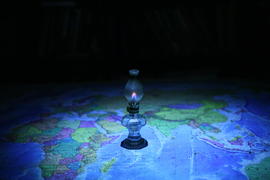 Карта мира и керосиновая лампа