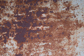 the sheet of iron rusty with the peeled-off paint. Background and texture