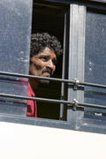 A passenger bus in the Indian looked through the open window to the street