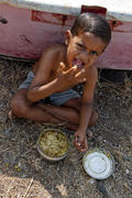 Boy eats porridge on Elephant Island
