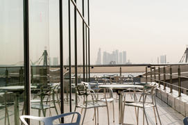 Terrace with table and chairs with views of the business center