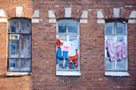 Dorm window with drying laundry in the winter