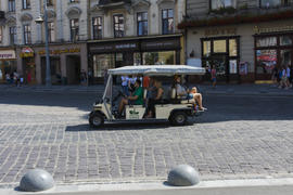 A little courtesy car. Cobblestones on the pavement of the city