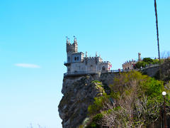 The ancient castle is on the high rock above the sea          